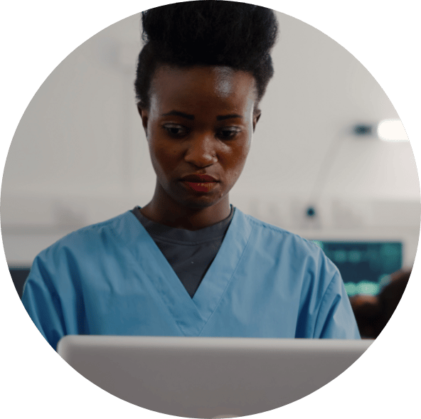 nurse looking at computer